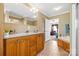 Spacious bathroom with double vanity, wood cabinets, granite countertops and a doorway leading to the bedroom at 118 Grain Dr, Stony Point, NC 28678