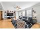 Cozy living room with hardwood floors, large windows, and modern decor at 118 Grain Dr, Stony Point, NC 28678