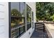 A balcony view with black railings and views of surrounding greenery at 11938 Fiddlers Roof Ln, Charlotte, NC 28277