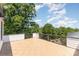 Open-air deck provides stunning views of the surrounding trees and neighborhood at 11938 Fiddlers Roof Ln, Charlotte, NC 28277