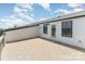 Spacious outdoor deck with tiled flooring offers ample space for relaxing and entertaining at 11938 Fiddlers Roof Ln, Charlotte, NC 28277