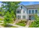 Beautiful three-story townhouse with white siding, black trim, and a well-maintained front yard at 11938 Fiddlers Roof Ln, Charlotte, NC 28277