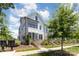 Charming two-story townhome features white siding, black trim, and manicured landscaping at 11938 Fiddlers Roof Ln, Charlotte, NC 28277