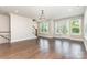 Spacious living room featuring hardwood floors, staircase, and ample natural light at 11938 Fiddlers Roof Ln, Charlotte, NC 28277