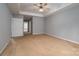 Neutral bedroom featuring tray ceiling and ceiling fan at 122 Ardmore Pl, Mooresville, NC 28117