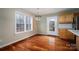 Cozy breakfast nook featuring hardwood floors, a window and an exterior door to the backyard at 122 Ardmore Pl, Mooresville, NC 28117