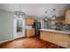 Well-lit kitchen featuring a modern island, wood cabinets and stainless steel appliances at 122 Ardmore Pl, Mooresville, NC 28117