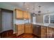 Kitchen featuring a stylish countertop, stainless steel dishwasher, and wood cabinets at 122 Ardmore Pl, Mooresville, NC 28117