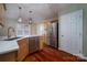 Kitchen features stainless steel appliances, a white countertop, and wood cabinets at 122 Ardmore Pl, Mooresville, NC 28117