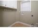 The laundry room has white cabinets, hooks and a washing machine hook-up at 122 Ardmore Pl, Mooresville, NC 28117