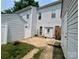 Backyard area with patio, vinyl siding, a storage shed, and some greenery at 12564 Jessica Pl, Charlotte, NC 28269