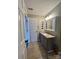 Bathroom features granite countertop vanity with decorative mirror, lighting, and neutral color palette at 12564 Jessica Pl, Charlotte, NC 28269
