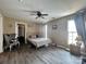 This bedroom has wood-look floors and is equipped with a ceiling fan at 12564 Jessica Pl, Charlotte, NC 28269