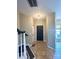 Inviting foyer with tile flooring, a dark-colored front door, and a staircase to the left at 12564 Jessica Pl, Charlotte, NC 28269