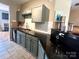 Functional kitchen featuring modern backsplash, sleek countertops, and ample cabinetry at 12564 Jessica Pl, Charlotte, NC 28269