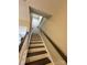 Carpeted staircase with handrails leading to the upper level at 12564 Jessica Pl, Charlotte, NC 28269