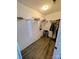 Spacious walk-in closet featuring wood floors, ample shelving, and hanging space for organized storage at 12564 Jessica Pl, Charlotte, NC 28269