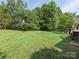 Large backyard surrounded by mature trees at 1271 Applewood Ln, York, SC 29745