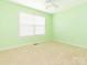 Bedroom with light green walls, neutral carpeting and a single window at 1271 Applewood Ln, York, SC 29745