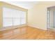 Bright bedroom with hardwood floors, a large window, and neutral paint at 1271 Applewood Ln, York, SC 29745
