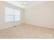 Cozy bedroom with neutral carpet, and a large window allowing ample natural light at 1271 Applewood Ln, York, SC 29745