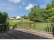 Wooden deck with views of the lawn and neighborhood, perfect for outdoor relaxation at 1271 Applewood Ln, York, SC 29745