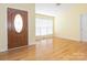 Inviting foyer with wood floors, a decorative front door, and a bright, airy feel at 1271 Applewood Ln, York, SC 29745