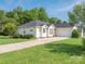 Charming single-story home featuring a well-maintained lawn, mature trees, and an attached two-car garage at 1271 Applewood Ln, York, SC 29745