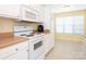 Charming kitchen with a white oven, a built-in microwave, and bright natural light at 1271 Applewood Ln, York, SC 29745