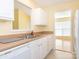 Bright kitchen featuring a stainless steel sink and white cabinetry at 1271 Applewood Ln, York, SC 29745
