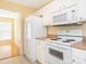 A well lit kitchen with a range, refrigerator, and microwave at 1271 Applewood Ln, York, SC 29745