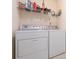 Well-equipped laundry room with white appliances and shelving at 1271 Applewood Ln, York, SC 29745