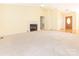 Bright living room with a fireplace, neutral carpet, and an open layout for entertaining at 1271 Applewood Ln, York, SC 29745