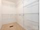 Spacious walk-in closet with bright white shelving and carpeted floor at 1271 Applewood Ln, York, SC 29745