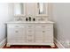 Elegant bathroom featuring double sinks with marble countertops and classic cabinetry at 128 W End St, Chester, SC 29706