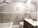 Bathroom with updated fixtures, tiled walls, and modern shower at 128 W End St, Chester, SC 29706