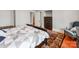 Cozy bedroom featuring a decorative rug, dark wooden furnishings, and a comfortable armchair at 128 W End St, Chester, SC 29706