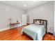 Bright bedroom with light walls, hardwood floors, and a cozy desk area at 128 W End St, Chester, SC 29706