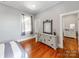 Bright bedroom with an elegant dresser and classic hardwood floors at 128 W End St, Chester, SC 29706