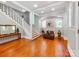 Bright foyer with hardwood floors, staircase, and decorative furnishings at 128 W End St, Chester, SC 29706