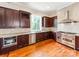 Spacious kitchen featuring stainless steel appliances, granite countertops, and custom cabinetry at 128 W End St, Chester, SC 29706