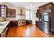 Kitchen featuring stainless steel range, dark cabinets and stainless fridge at 128 W End St, Chester, SC 29706