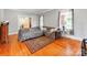 Living room featuring hardwood floors, large window, and access to other rooms at 128 W End St, Chester, SC 29706