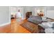 Living room featuring hardwood floors, sofa, access to the dining room and hall at 128 W End St, Chester, SC 29706