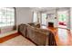 Cozy living room with fireplace, hardwood floors, and large windows at 128 W End St, Chester, SC 29706