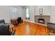 Home office featuring hardwood floors and a brick fireplace at 128 W End St, Chester, SC 29706