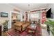 Comfortable living room featuring hardwood floors, built-in shelving, decorative rug, and neutral paint at 132 N Confederate Ave, Rock Hill, SC 29730