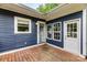 Wooden deck off the side of the house featuring two doors and a window at 14115 Old Statesville Rd, Huntersville, NC 28078