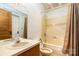 Bathroom featuring a wood vanity with a sink, shower and tub with a shower curtain at 14115 Old Statesville Rd, Huntersville, NC 28078