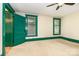Bright bedroom with green trim, neutral walls, and ample natural light at 14115 Old Statesville Rd, Huntersville, NC 28078